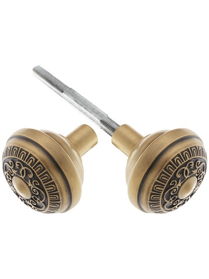 Pair of Egg and Dart Design Door Knobs in Antique Brass.